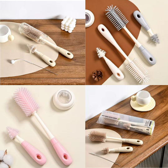 Set of cleaning brushes with different handles and bristle designs on a wooden surface.